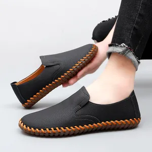 Handmade men's black leather casual slip-on loafers with distinctive orange stitching details