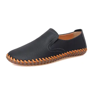 Handmade stitched men's black loafers with orange decorative seams and soft rubber sole