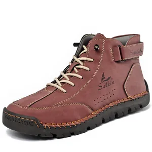 Detailed view of men's high-top leather Martin boots with handmade stitching details