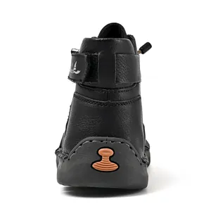 Rear view of men's black high-top leather Martin boots with hand-stitched detail