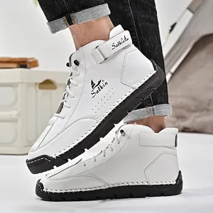 Detail view of white hand-stitched high-top Martin boots for men with rubber sole.
