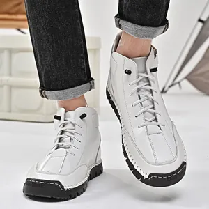 White men's leather high-top boots with hand-stitched details and durable black rubber soles.