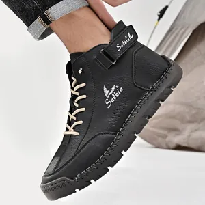Close-up of black leather Martin boot with hand-stitched sole and Velcro ankle strap