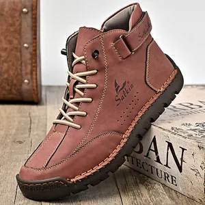 Durable hand-stitched men's high-top outdoor leather boots in a rustic brown finish