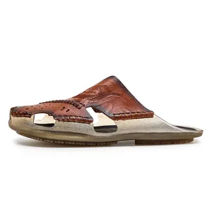 Side view detail of men's genuine leather closed-toe sandals with embossed pattern.