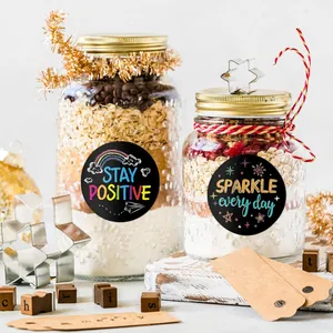 Round motivational stickers with colorful "STAY POSITIVE" and "SPARKLE" text.