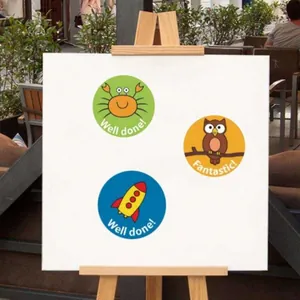 Cartoon reward stickers with crab, owl and rocket motifs on display board