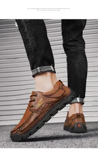 Detail of hand-stitched brown leather casual shoes with lace-up design for men.