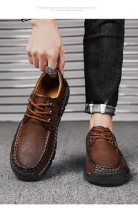 Detailed view of handmade stitching on brown leather casual shoes for men with laces
