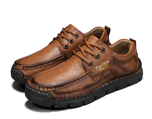 Detailed view of brown hand-stitched men's leather shoes with durable black sole
