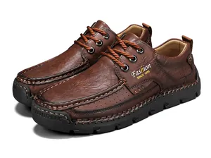 Detailed view of hand-stitched brown leather casual men's shoes with lace-up design