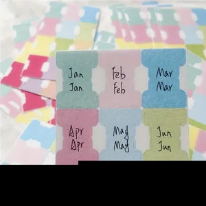 Detail of colorful writable monthly index tab stickers for office organization