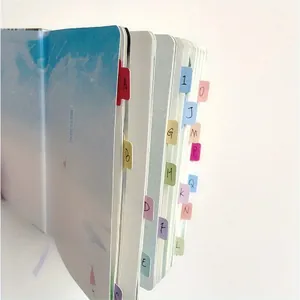 Colorful index tabs stickers on notebook pages for easy categorization and marking