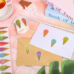 Detailed macro view showing colorful laser glitter ice cream cone stickers applied on envelopes