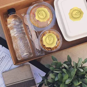 Detailed view of gold embossed heart stickers used for sealing food packaging