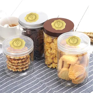Decorative gold embossed heart stickers used as elegant seals on clear snack jars