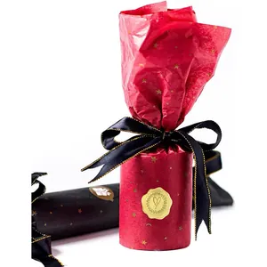 Macro view of premium golden embossed heart stickers used as elegant gift wrap seals