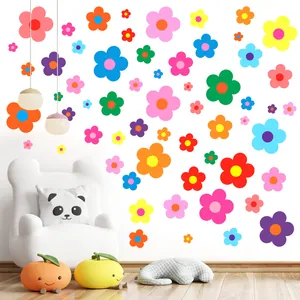 Set of colorful flower wall stickers applied in a cozy children's room setting.