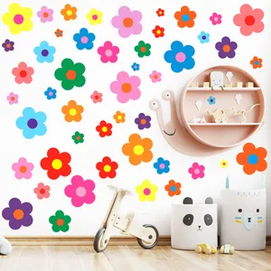 Detailed view of colorful flower wall decals in a stylish nursery setting with props