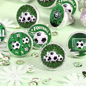 Close-up of green soccer football stickers applied to chocolate party favors