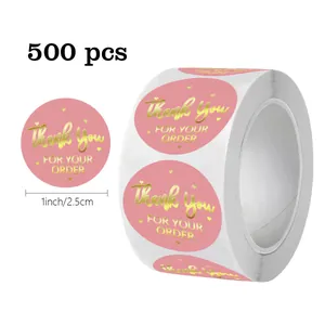 Detailed view of 500 pink oval stickers featuring gold foil thank you text, 1 inch size