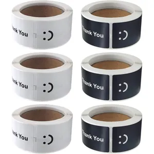 Detailed view of rectangular black and white gift stickers with Thank You and smiley face