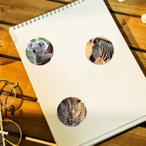 Detailed view of round animal stickers featuring koala, zebra, and leopard motifs
