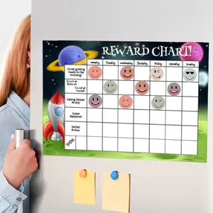 Close-up of a space-themed kids reward chart with colorful smiley face stickers