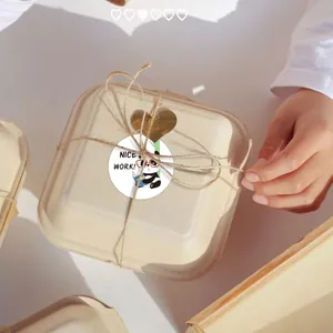 Detail of cute panda reward sticker with 'Nice Work!' text on eco-friendly gift box packaging