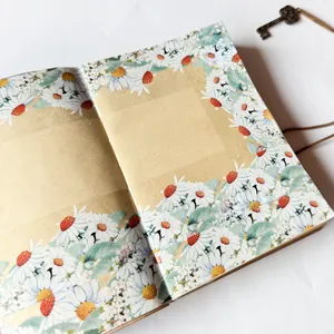 Close-up view of elegant daisy pattern PET tape applied on a kraft paper notebook page