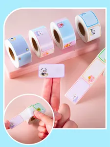 Detail view of peeling waterproof cartoon name label stickers from a self-adhesive roll