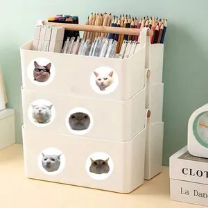 Detailed view of funny cat meme stickers applied on white desk storage organizing bins
