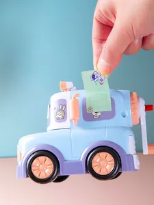 Close-up detail of a hand applying a colorful cartoon waterproof label sticker to a car toy