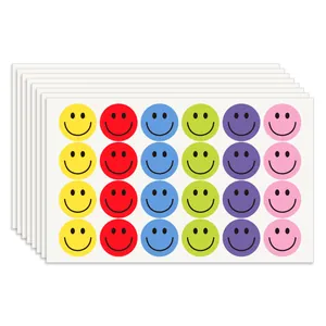 Stack of colorful 2.5cm smiley face reward stickers for children in 6 vibrant colors.