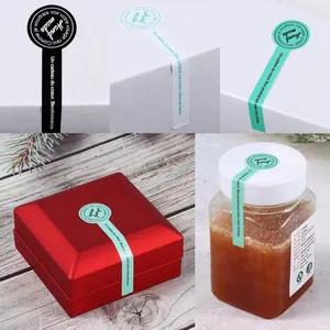 Detail showing handmade sealing stickers in various colors on gift boxes and jars