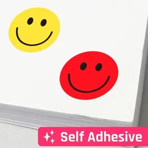 Macro view of colorful self-adhesive round smiley face reward stickers for children