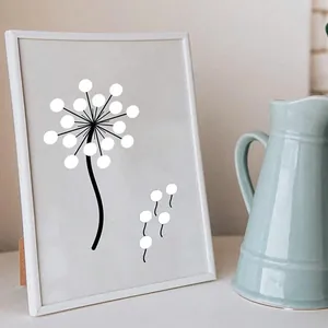 Art mural DIY créatif utilisant des autocollants ronds blancs sur un cadre pissenlit.