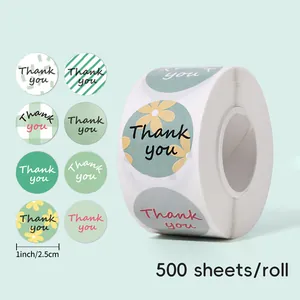 Detail showing a roll of 500 round floral green thank you stickers, 1 inch size