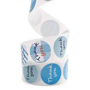 Detailed macro shot of blue circular Thank You sticker roll with various elegant patterns