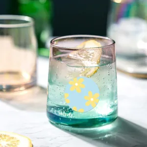 Detailed macro view of a round floral pattern sticker on a glass for gift sealing