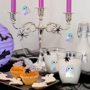 Detailed macro shot of holographic ghost stickers on Halloween party glasses and snacks