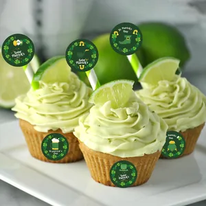 Detailed view of green St. Patrick's Day shamrock stickers decorating lime cupcakes