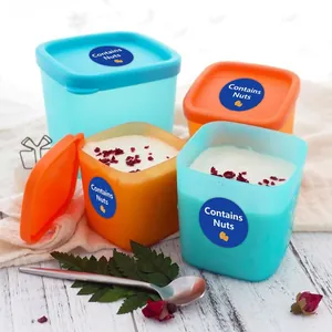 Blue round 'Contains Nuts' food allergy warning seal labels shown on food containers