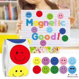 Detailed view of colorful smiley face stickers roll, 1 inch various emoji expressions