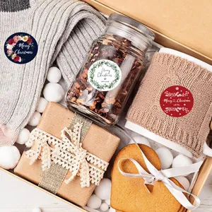 Round Christmas stickers applied to a festive gift box, glass jar, and wrapped present
