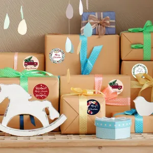 Festive round Christmas stickers applied on gift boxes for DIY holiday gift decoration