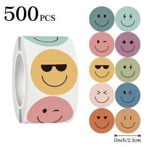 Detailed macro view showing a 500pcs smiley face sticker roll with 1 inch mixed colors