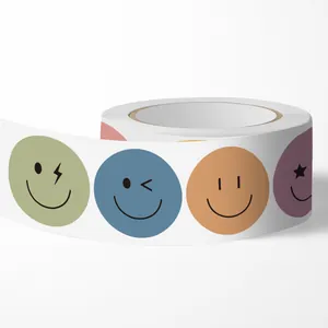 Detailed view of colorful smiley face adhesive stickers in a roll for decoration