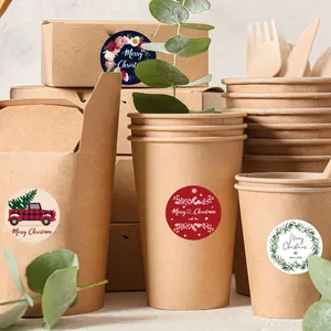 Close-up of festive Christmas stickers applied to eco-friendly kraft paper packaging