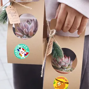 Close-up of cartoon animal reward stickers on kraft paper gift bags for decoration.